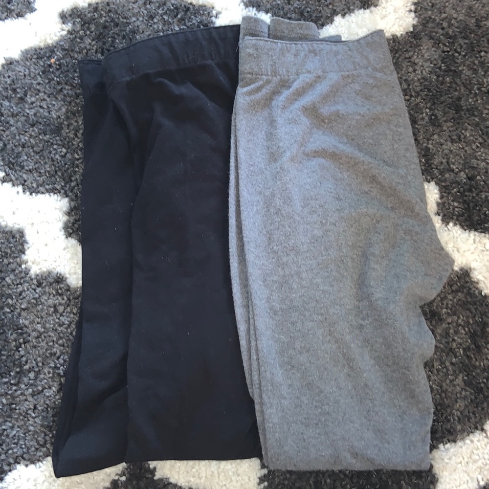 2 pairs of small black leggings from garage. One pair of small gray leggings.
